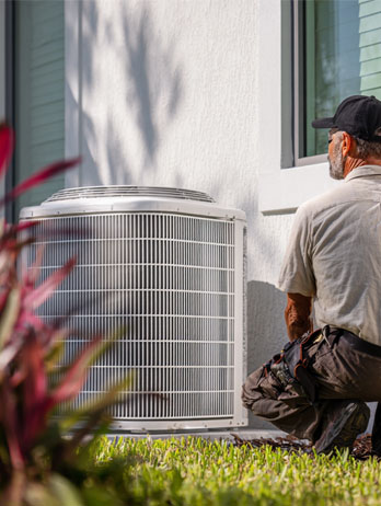 F&F HVAC technician servicing residential air conditioning system